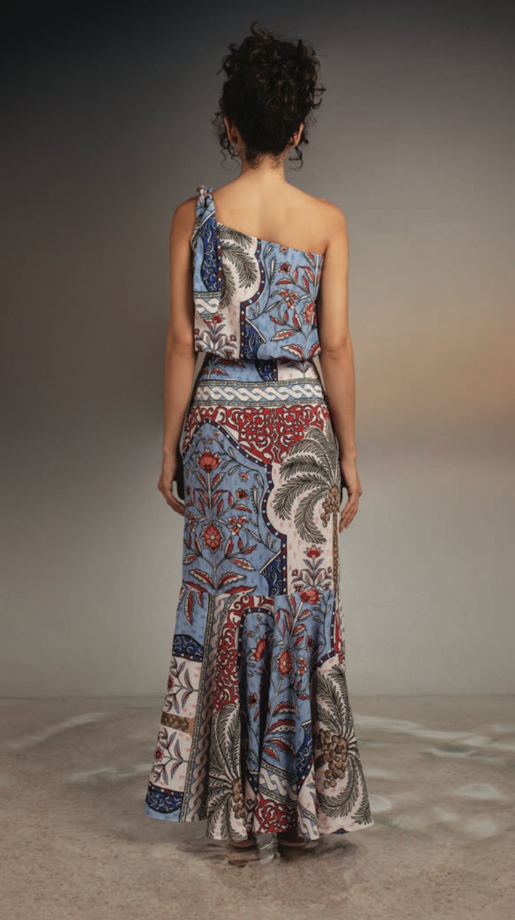 back of model wearing dorotea pampa skirt with on plain background