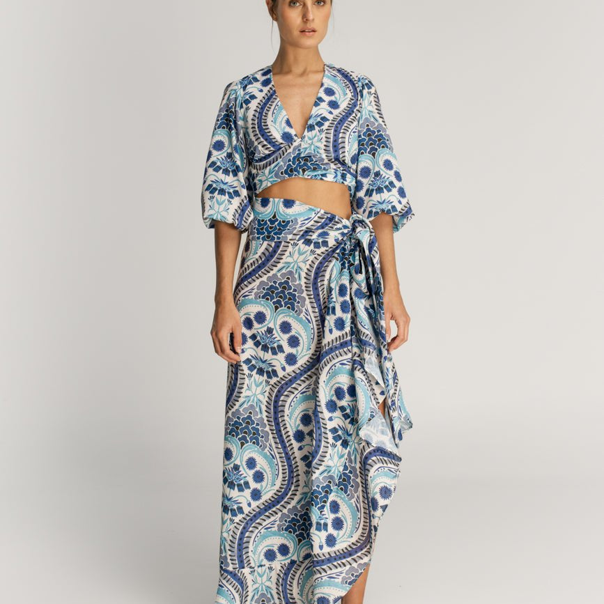 Model wearing Eloisa Blue Tumaco Skirt on a plain background