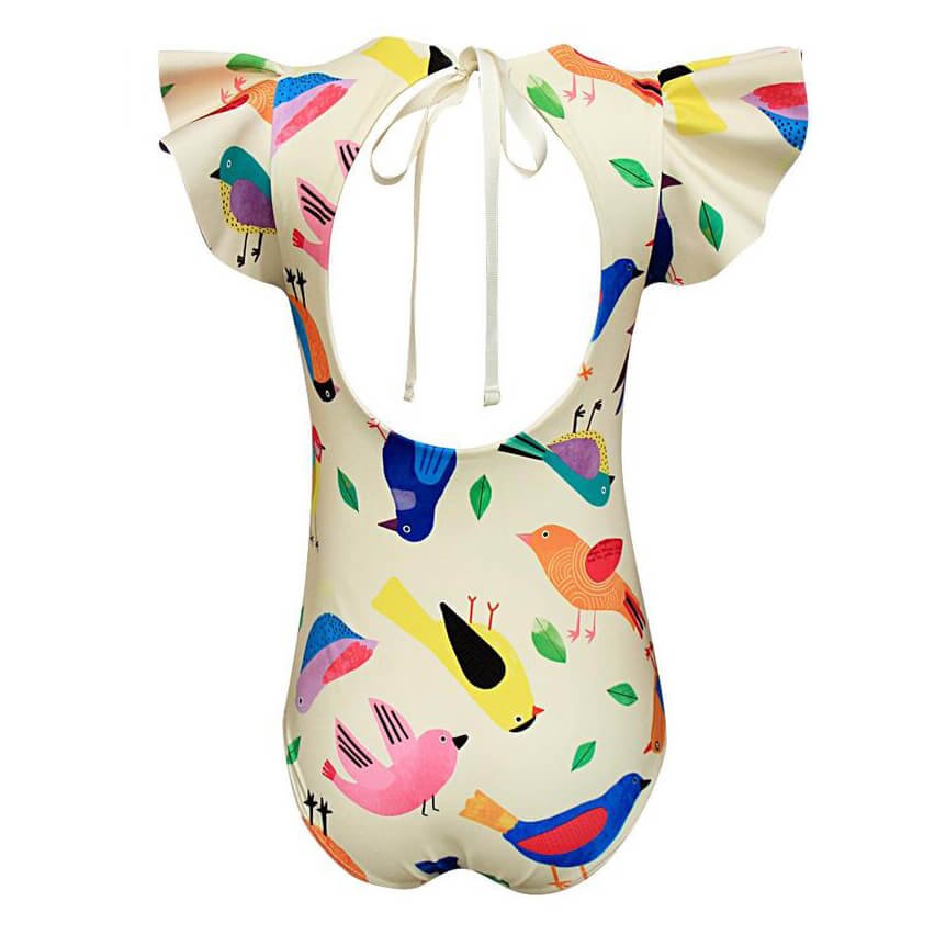 The back of a cream swimsuit with a colorful bird pattern for girls. This swimsuit has ruffle sleeve and is true to size.