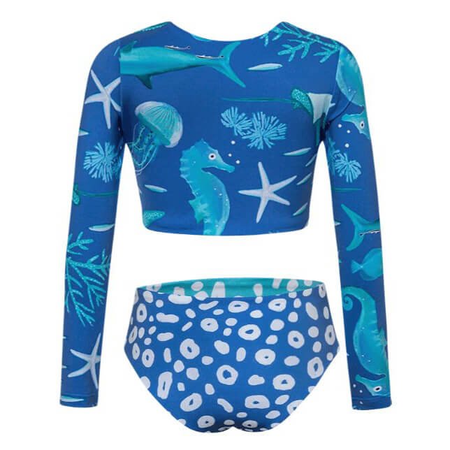 Back of swimsuit featuring a sealife print over the top. A reversible blue and aqua cheetah print over the bottom. The swimsuit is shown over a white background.
