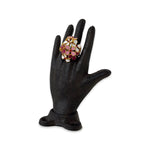 Hydrangea Ring on black hand sculpture on a white background