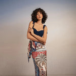 model wearing krystel pampa sarong with Sienna Andina Bikini Top on simple background