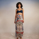 model wearing krystel pampa sarong with Sienna Andina Bikini Top on simple background