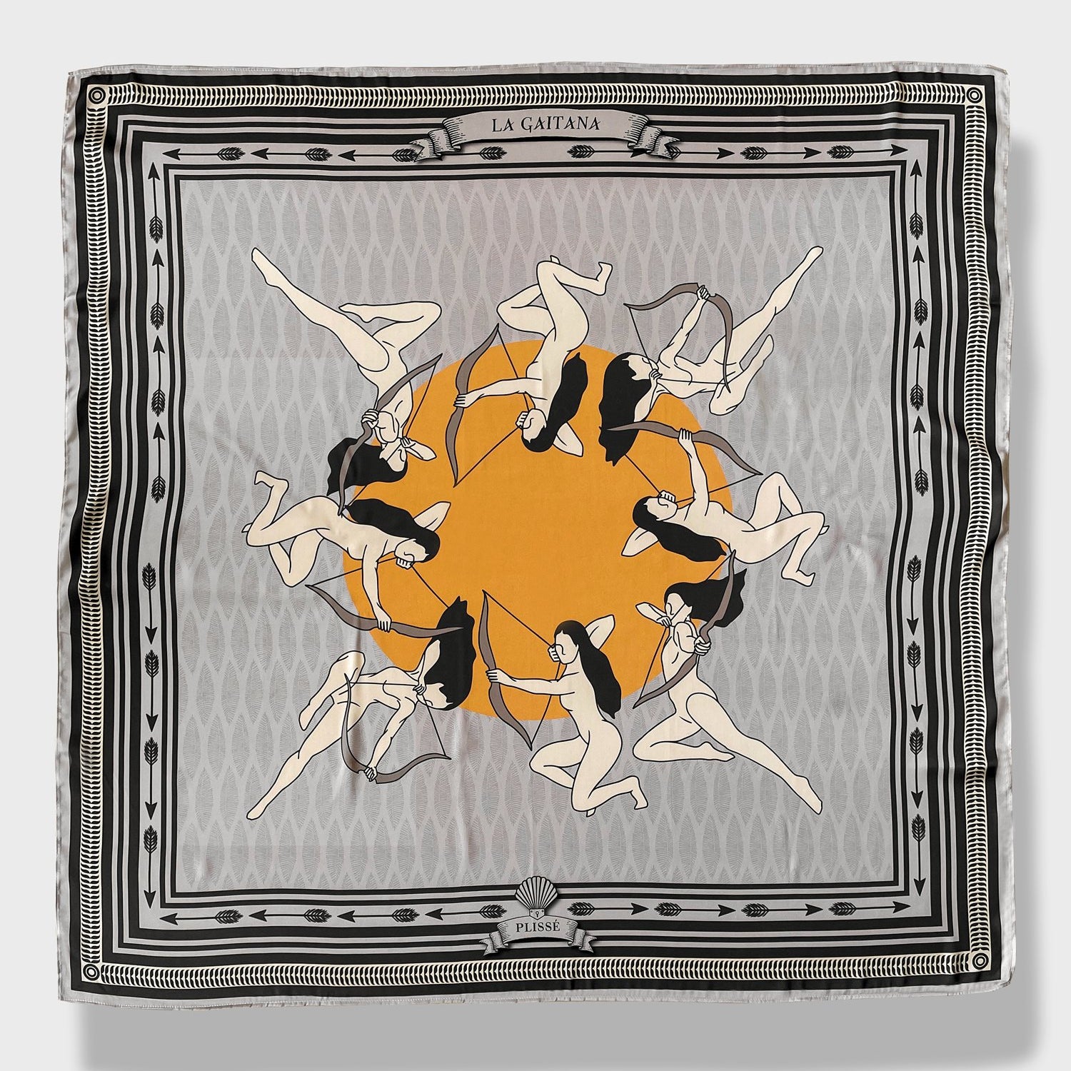 La Gaitana Scarf by Plissé. Image of 8 Cacica Gaitana in a circle over a yellow dot. The whole deign over over a light grey geometric pattern with a frame like border and arrow border. The overall tone of the scarf is a washed out grey. 