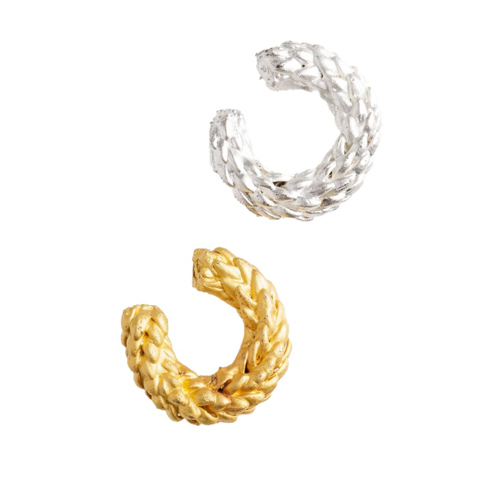 Image of two earcuffs. One in gold and another in silver. The purpose of this image is to highlight the earcuffs by Alma Jewelry. 