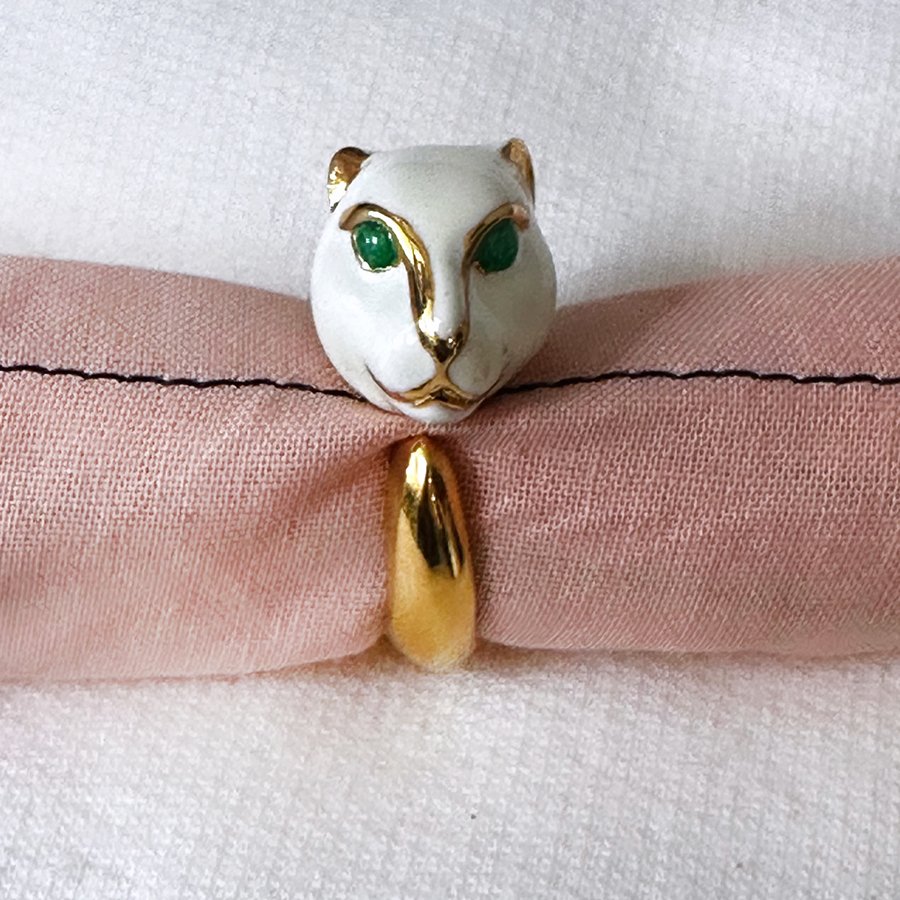 Testa di Pantera Ring by Eleonora Varini - White panther head with green eyes on a gold ring.