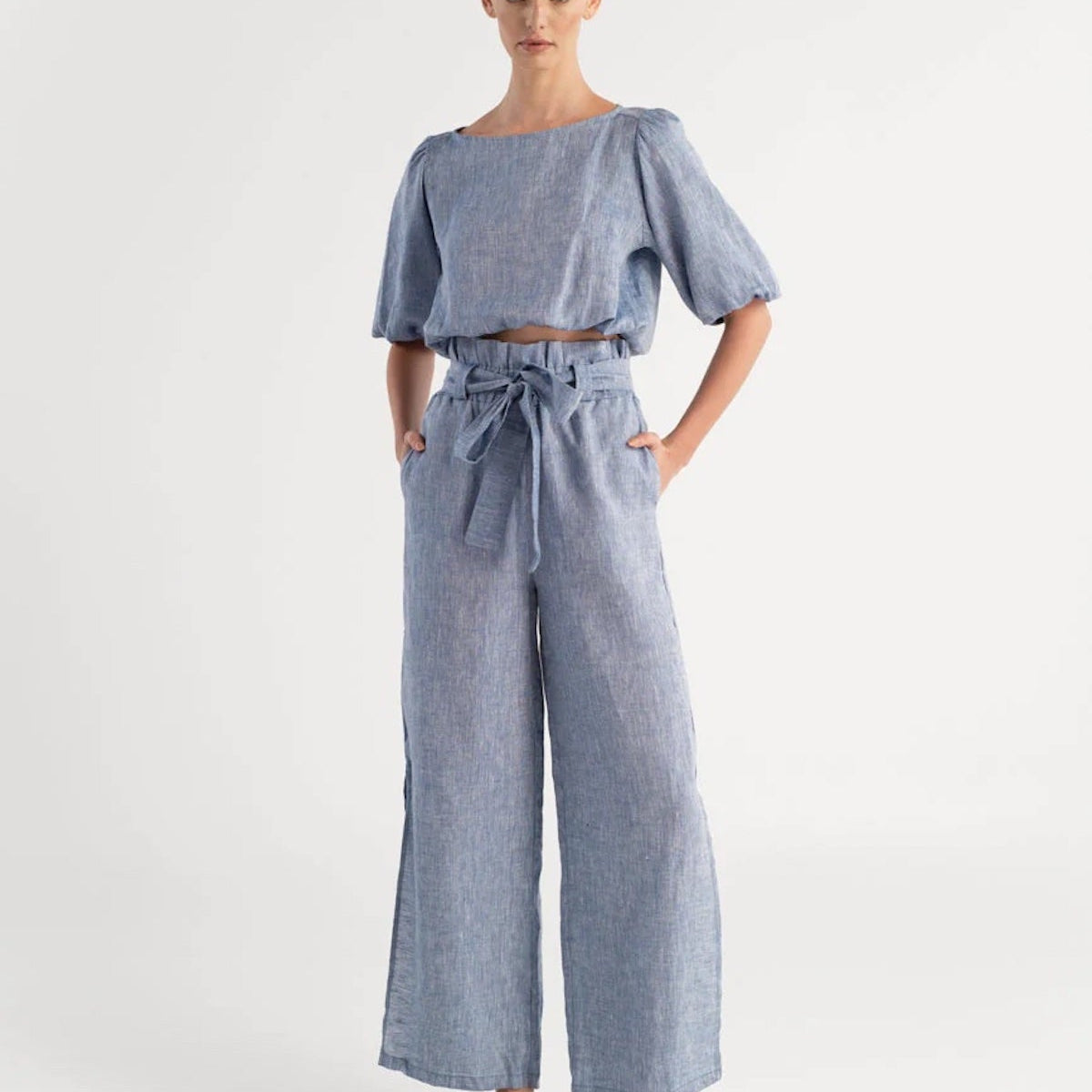 Model wearing Verona Sky Blue Hemp Pants with the Ivette Sky Blue Hemp Blouse on a white background