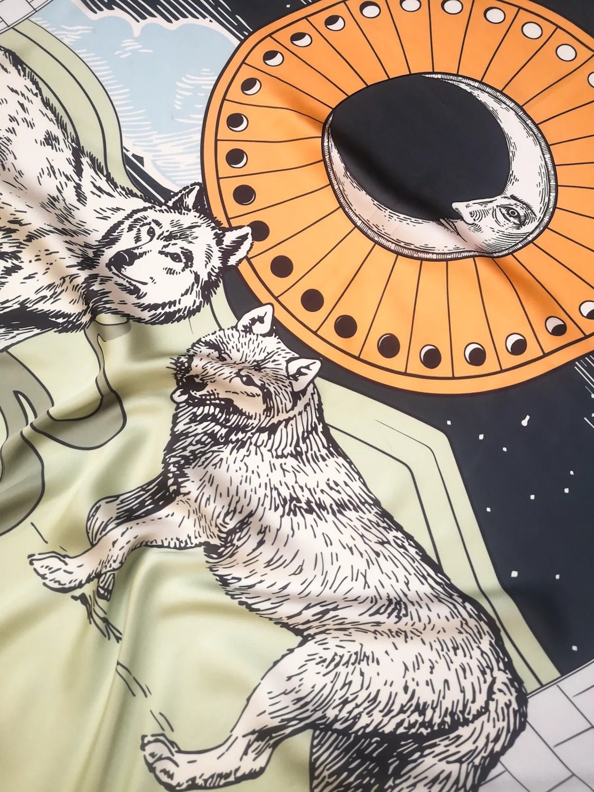 Close up of wolves on Zodiac Moon Scarf by Plissé.