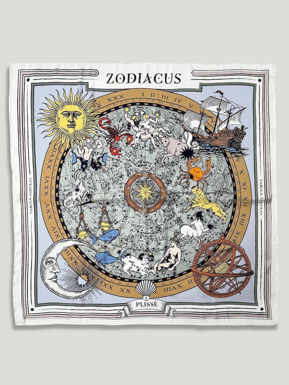 Zodiac Scarf for all zodiac signs made by Plissé. Image of all zodiac symbols, like the twins, bull, crab, lion, archer, etc. It is on top of a astrological background. Details like a orange ecliptic, yellow sun, and white moon. The scarf is white with brown details displayed on plain white background.
