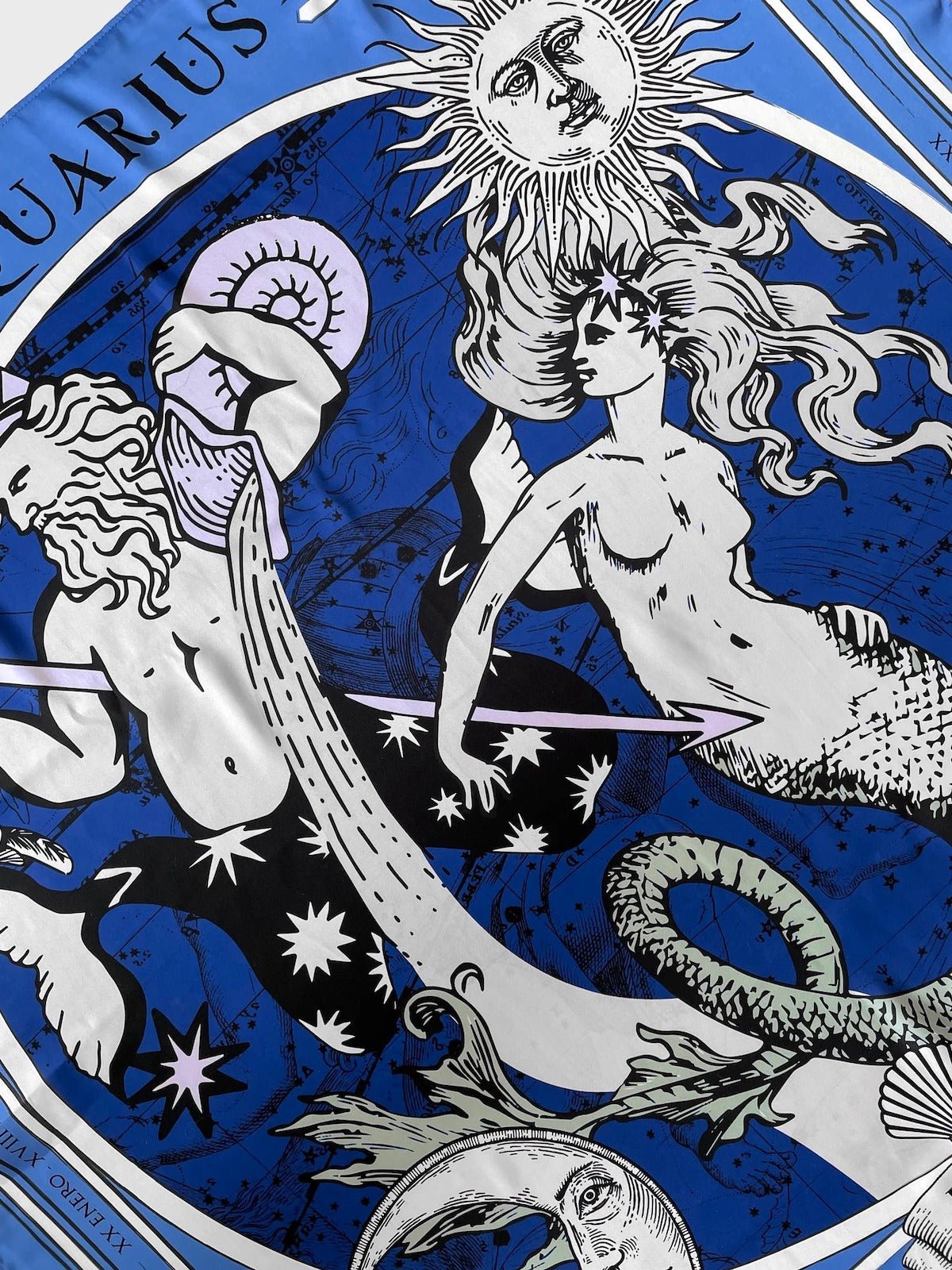 Close up of the water bearer and mermaid on the Zodiac Scarf for Aquarius by Plissé.