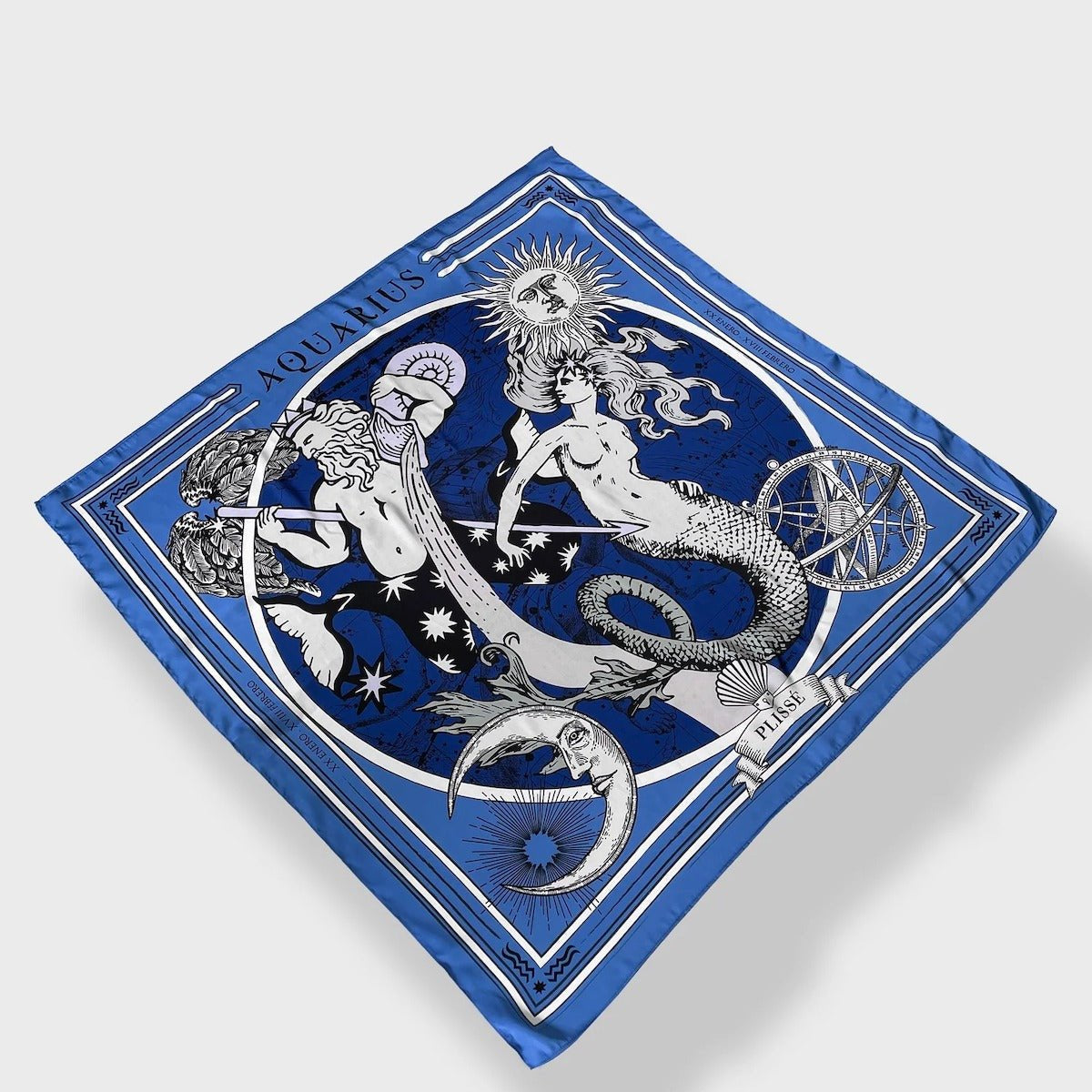 Zodiac Scarf for Aquarius by Plissé. Image of water bearer, mermaid, sun, moon, and the eliptic. The blue scarf is floating on a white background.