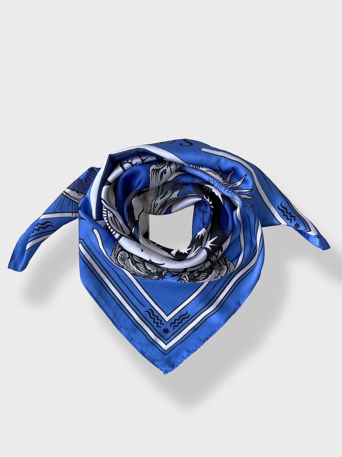 The Zodiac Scarf for Aquarius wrapped as if around neck but pictured on white background.