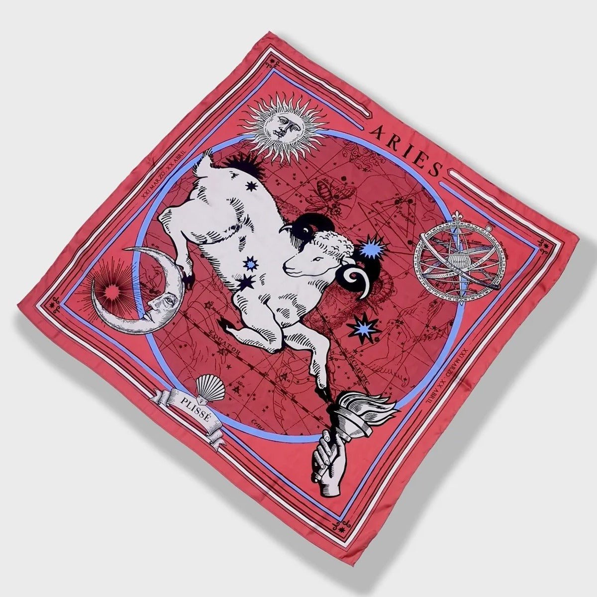 Zodiac Scarf for Aries by Plissé. Red scarf with image of a Ram, sun and moon details, hand holding torch, all on astrological background. Scarf pictured floating on a white background.