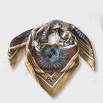 Zodiac Scarf for Leo. Image of fierce lion over astrological background, moon and sun details, in golden tone. Scarf wrapped on surface as if on neck. 