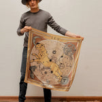 Man holding the Zodiac Scarf for Leo in the air.
