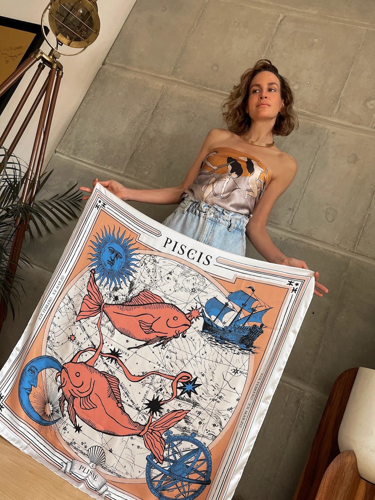 Woman holding the Zodiac Scarf for Pisces