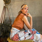 Woman modeling the Zodiac Scarf for Pisces as a skirt