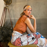 Woman modeling the Zodiac Scarf for Pisces as a skirt